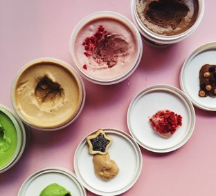 Assorted desserts in cups.